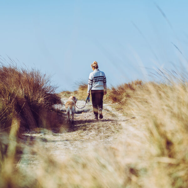 Woman with dog on beach